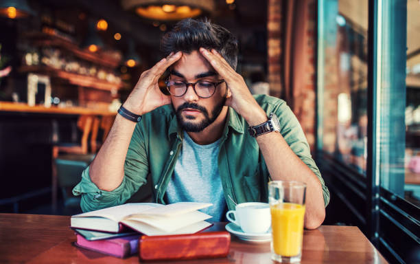 istock Young student learning in the cafe. Education, lifestyle concept 1084228544