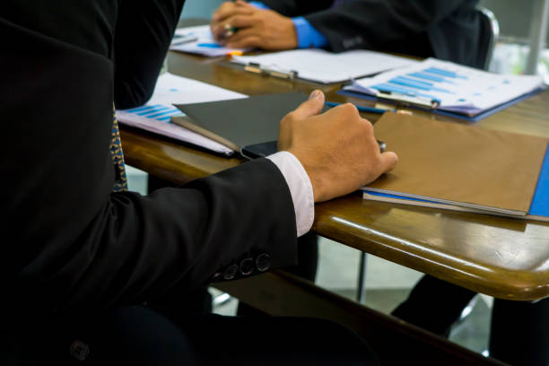 istock Midsection Of Businessman Working At Desk In Office 1084238902