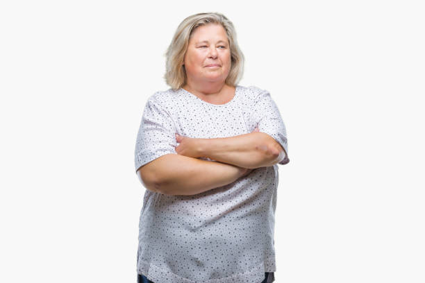 istock Senior plus size caucasian woman over isolated background smiling looking side and staring away thinking. 1084240026