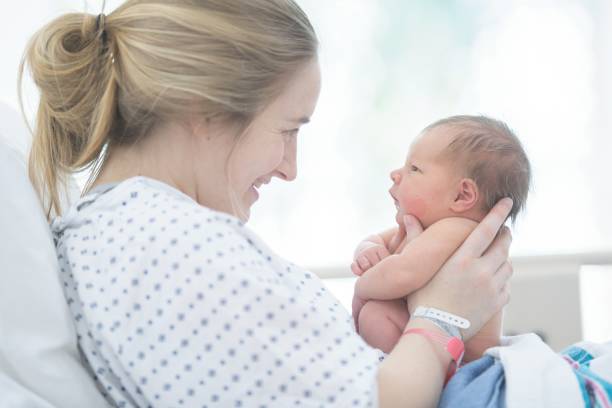 istock Holding Her Newborn Daughter 1084242826