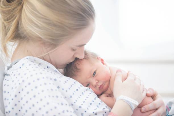 istock Kissing Newborn 1084242844