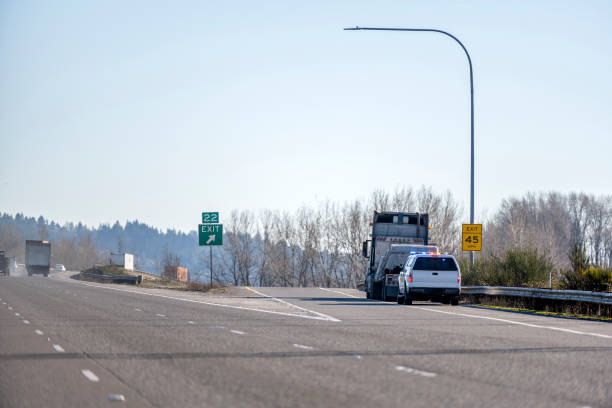 istock Police stopped big rig semi truck for inspection on the highway exit 1084248274