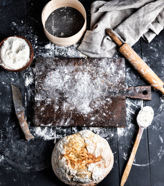 istock baked bread, white wheat flour, wooden rolling pin 1084251020