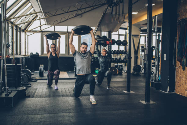 istock Personal Weight Training In The Gym 1084255432
