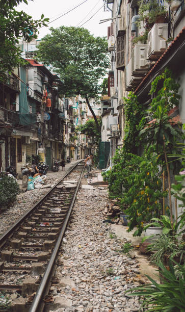 istock Railroad Tracks Amidst Buildings In City 1084276292