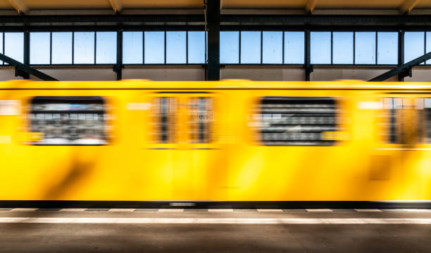 istock Blurred Motion Of Train At Railroad Station Platform 1084279186