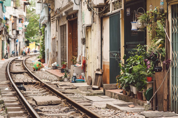 istock Railroad Tracks Amidst Buildings In City 1084279746