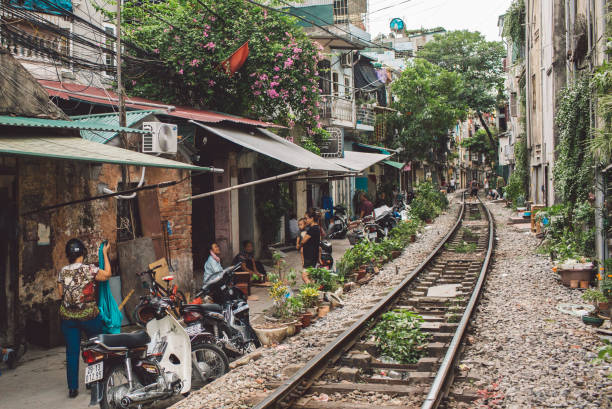 istock Railroad Tracks Amidst Buildings In City 1084279928