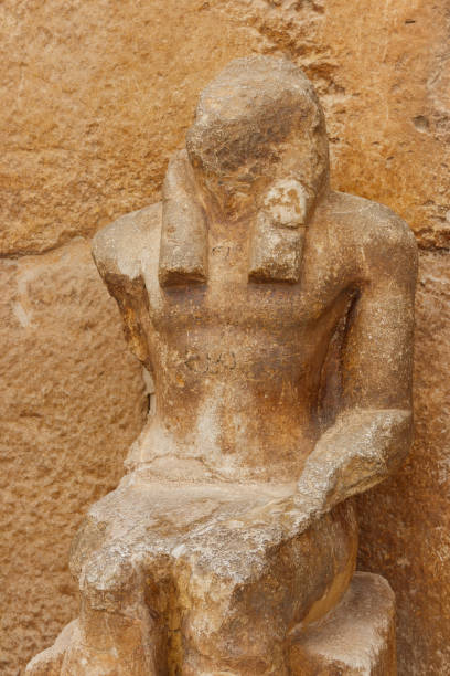 istock Old statue near pyramid temple in Giza, Cairo, Egypt 1084282398