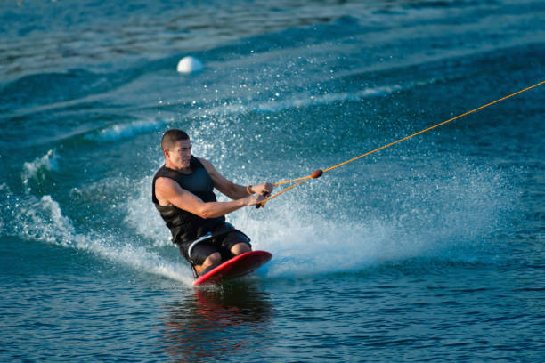 istock Mid Adult Man Kiteboarding On Sea 1084283540