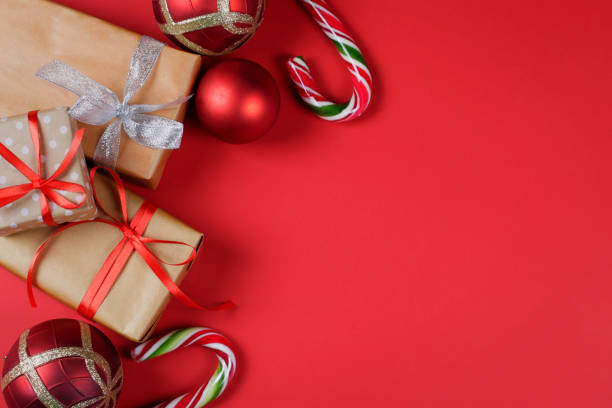 istock Presents and Christmas accessories on red background. 1084286686