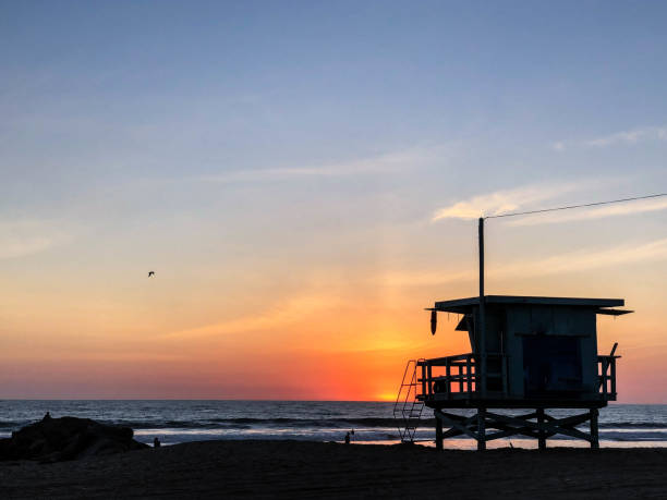 istock Sunset on the beach in Venice, CA over the Pacific Ocean 1084286852
