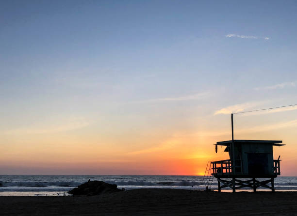 istock Sunset on the beach in Venice, CA over the Pacific Ocean 1084286878