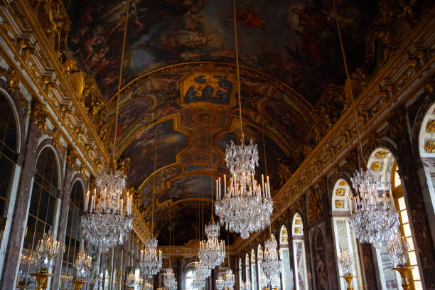 The Hall of Mirrors of the Royal Palace of Versailles Versailles , France - April 13, 2014: The Hall of Mirrors (Galerie des Glaces) of the Royal Palace of Versailles. ballroom stock pictures, royalty-free photos & images
