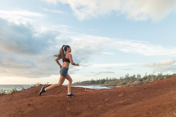 istock Solo female jogger on Hawaii coastline 1084295528