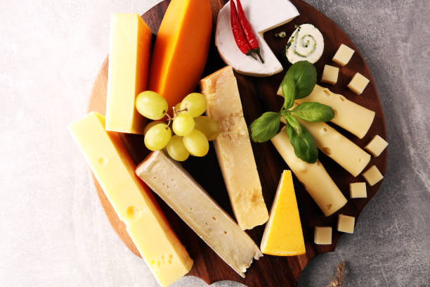 istock Cheese plate served with grapes, various cheese on a platter 1084295844