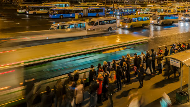 istock passengers waiting and boarding buses at the bus terminal 1084300540