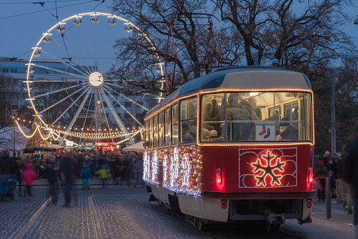 Brno,Czech Republic-December 16,2018: Christmas tram, market and christmas ferris wheel  at Moravian square at advent time on December 16, 2018 Brno, Czech Republic