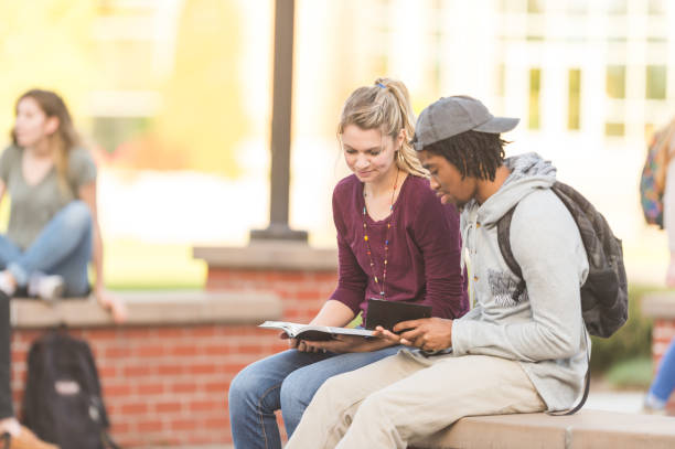 istock College students praying outside on campus 1084316356
