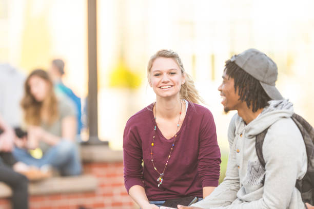 istock Two college students studying outside and reading the Bible 1084316360