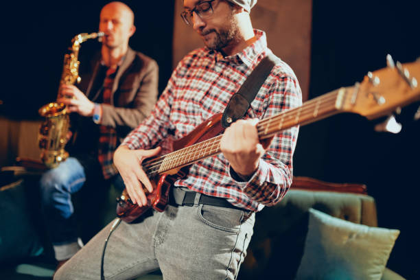 istock Two Caucasian great musicians playing instruments. 1084318926