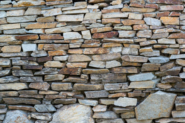 istock Detail of Medieval stone wall, background 1084322408