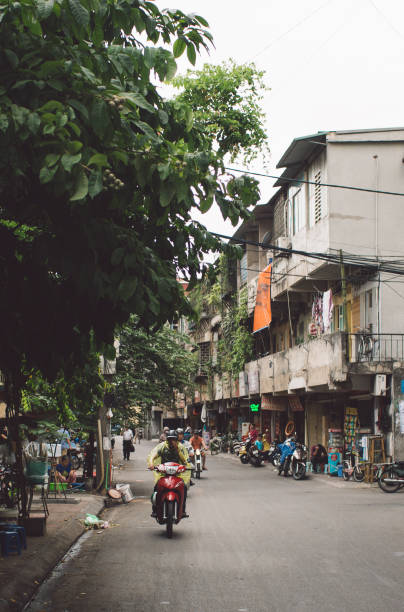 istock People Riding Motor Scooters On Road In City 1084322464