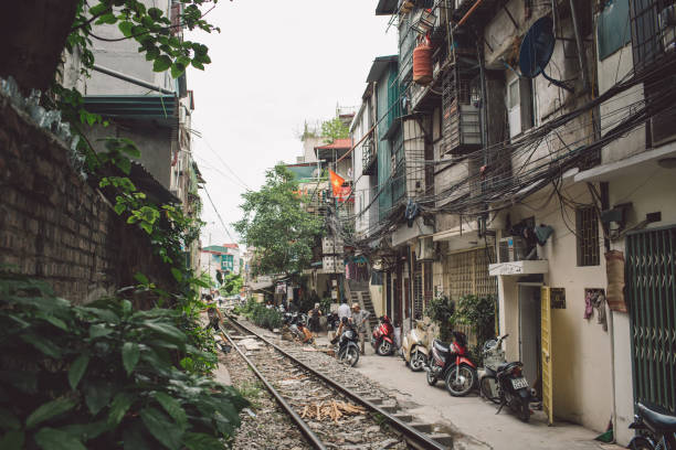 istock Railroad Tracks Amidst Buildings In City 1084323678