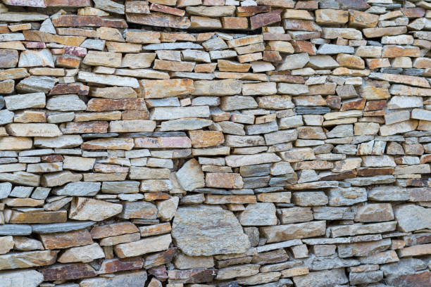 istock Detail of Medieval stone wall, background 1084324520