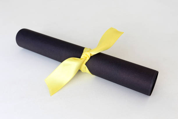 istock Black paper with yellow ribbon 1084327092