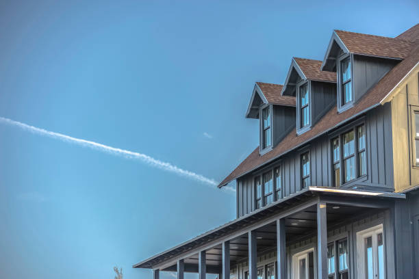 istock Sunlit home and sky with contrail in Daybreak Utah 1084329500