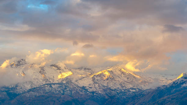 istock Sunlight mountain and clouds at Lone Peak Utah 1084329514