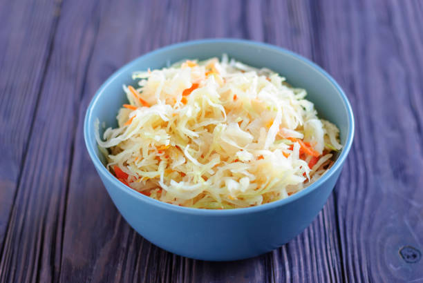 istock Bowl with sauerkraut standing on table 1084334494