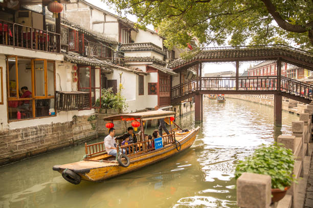 Zhujiajiao at Shanghai China Shanghai, China - October 15, 2018: Zhujiajiao is a well-known ancient water town with a history of more than 1700 years and featured with unique old bridges, small rivers and houses.  The population of Zhujiajiao is around 60,000.  Archaeological findings dating back 5,000 years have also been found. Zhujiajiao stock pictures, royalty-free photos & images