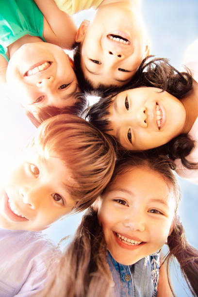 istock closeup Multi-ethnic group of schoolchildren face 1084342328