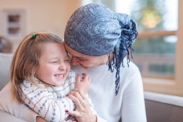 istock Young mom with cancer holds her daughter 1084342556