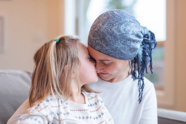 istock Young mom with cancer holds her daughter 1084342566