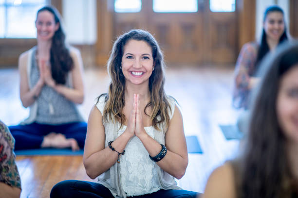 istock Smiling Women Meditating 1084351386