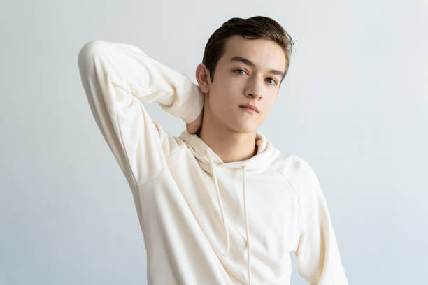 istock Confident teen boy touching neck 1084353472