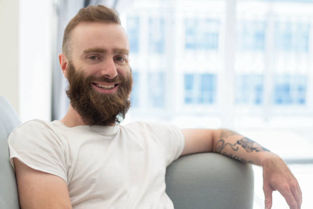 istock Cheerful bearded hipster posing at home 1084353874