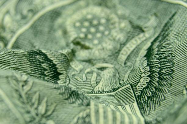 Back of the US dollar bill, featuring the stripes from the American coat of arms. Selective focus abstract of the stripes from the great seal. dollar bill eagle stock pictures, royalty-free photos & images
