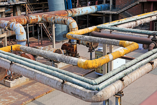 Thermal insulation pipe and mechanical equipment in the factory, closeup of photo
