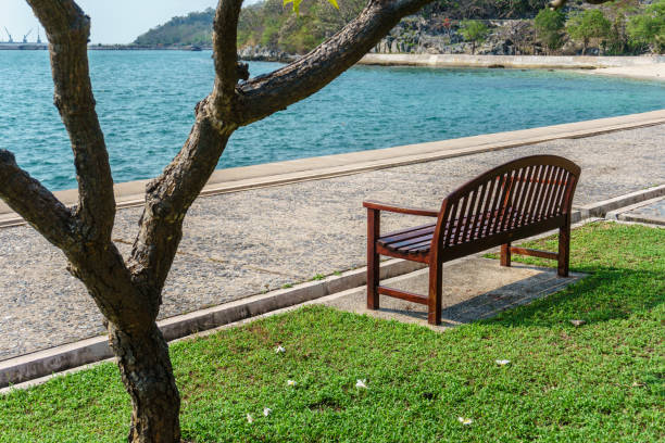 istock Wooden Bench on seaside in Si Chang Island 1084364986
