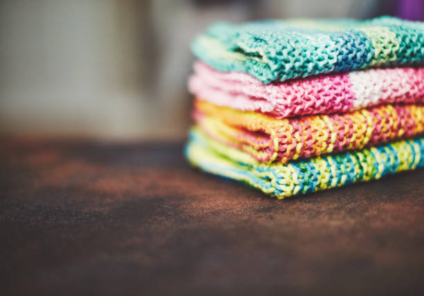 Crafts and hobbies. Hand knitted colorful fabrics background