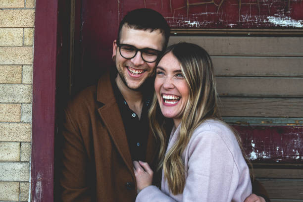 istock Happy Smiling Laughing Young Hipster Couple Looking at the Camera 1084367032