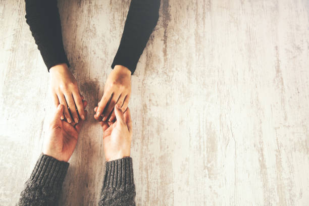 istock woman and man hand 1084368750