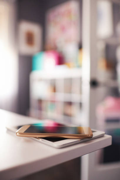 istock Digital tablet and phone on desk in modern home office 1084370440