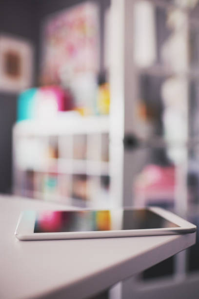 istock Digital tablet on desk in modern home office 1084370486