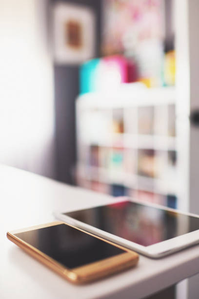 istock Digital tablet and phone on desk in modern home office 1084370488