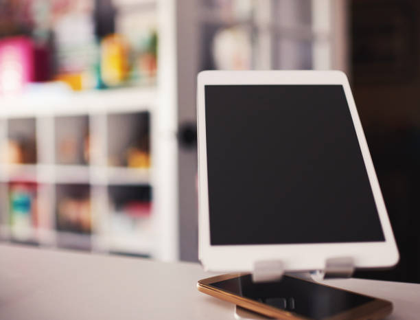 Close up shot of unrecognisable young woman plugging in cable to charge her digital tablet